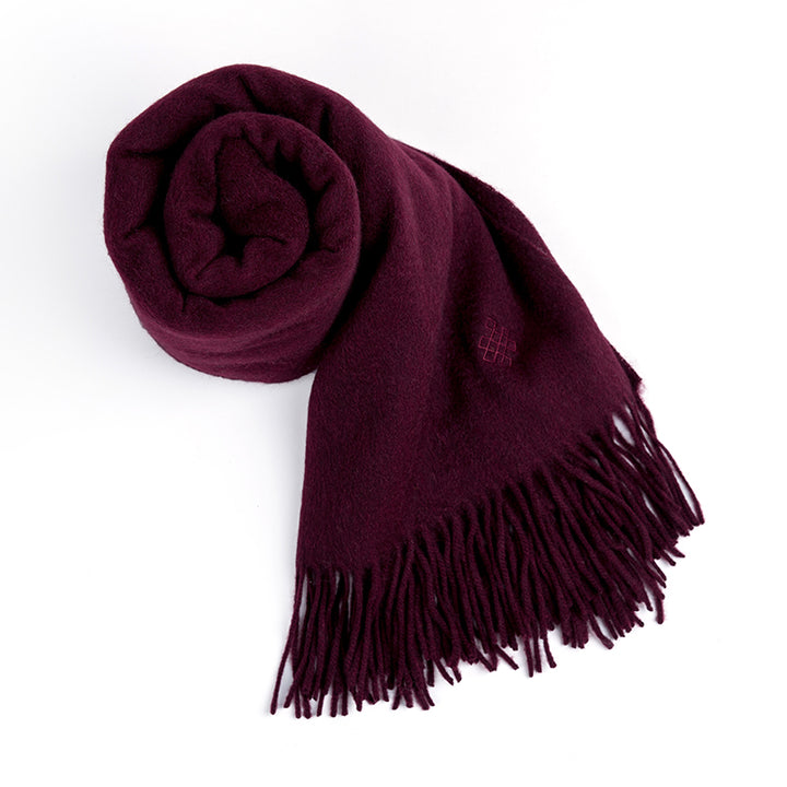 Add a pop of color with the Serene Yak Wool Scarf in Cranberry. Made from 100% yak wool, this soft and warm scarf is perfect for chilly days.

