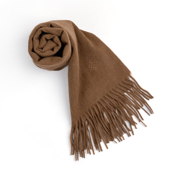 Wrap yourself in luxury with the Serene Yak Wool Scarf in Caramel. Made from 100% yak, it offers exceptional softness, warmth, and versatility for any winter outfit.


