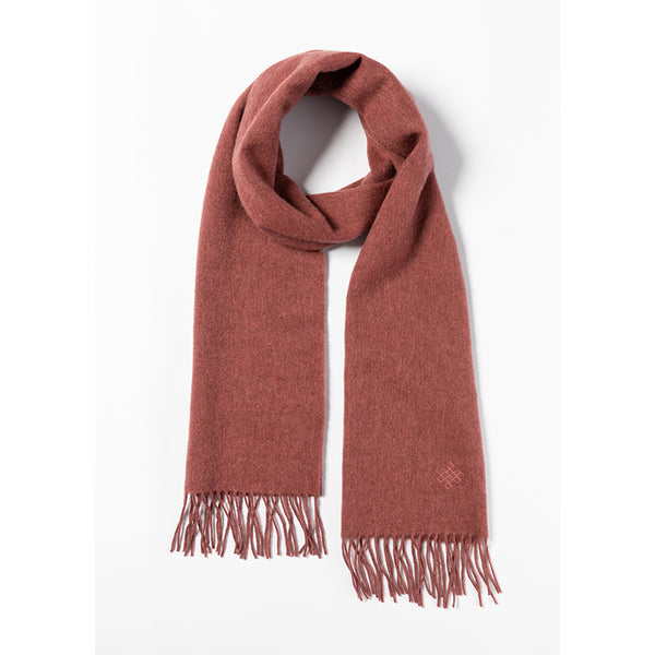 Shop the Serene Dusty Pink Yak Wool Scarf for a soft, luxurious feel. Perfect for layering in the cold weather, this timeless scarf adds elegance to any outfit.


