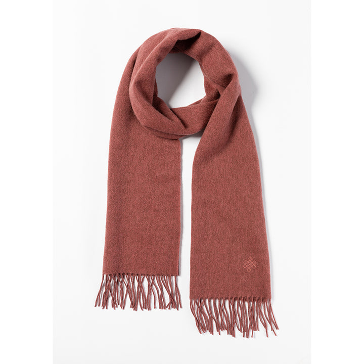 Shop the Serene Dusty Pink Yak Wool Scarf for a soft, luxurious feel. Perfect for layering in the cold weather, this timeless scarf adds elegance to any outfit.

