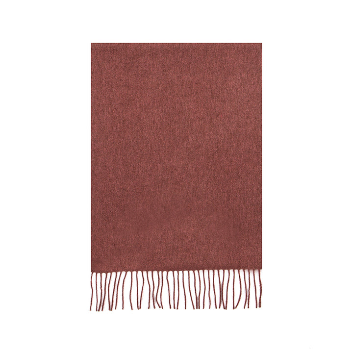 Shop the Serene Dusty Pink Yak Wool Scarf for a soft, luxurious feel. Perfect for layering in the cold weather, this timeless scarf adds elegance to any outfit.

