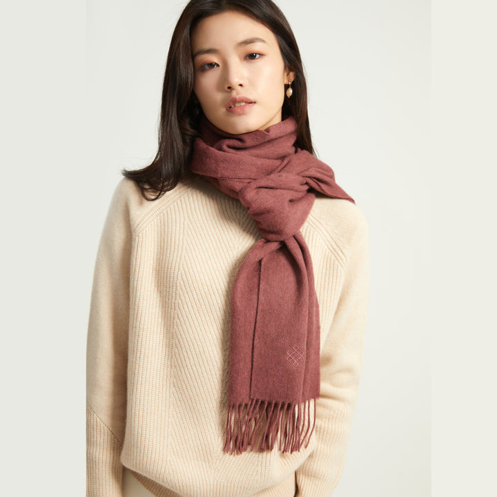 Shop the Serene Dusty Pink Yak Wool Scarf for a soft, luxurious feel. Perfect for layering in the cold weather, this timeless scarf adds elegance to any outfit.

