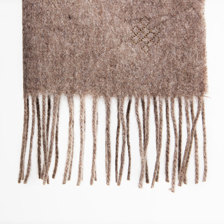 Shop the Serene Earth Yak Wool Scarf for luxurious warmth and elegance. A versatile accessory that adds timeless style and comfort to any winter outfit.


