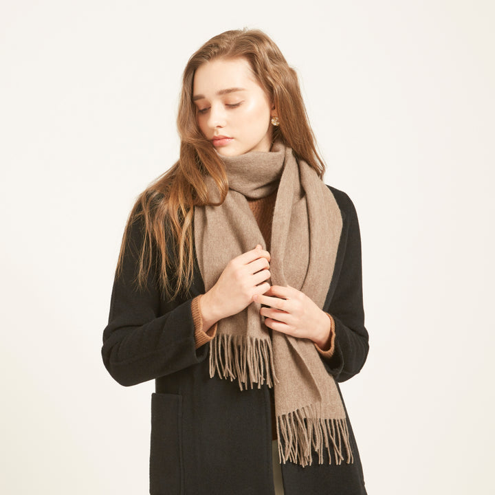 Shop the Serene Earth Yak Wool Scarf for luxurious warmth and elegance. A versatile accessory that adds timeless style and comfort to any winter outfit.

