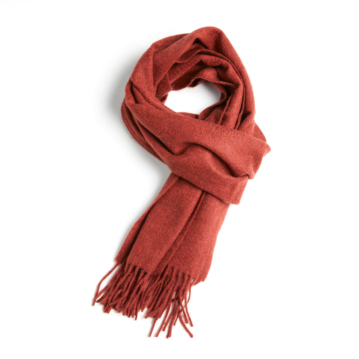 Discover the Serene Rust Yak Wool Scarf for a cozy, luxurious addition to your winter wardrobe. Soft, warm, and stylish – the perfect cold-weather accessory.


