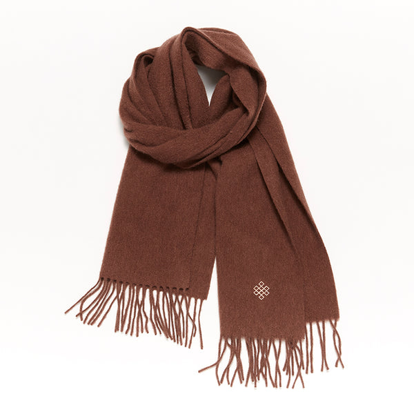 Experience ultimate comfort and warmth with the Serene Sugar Graham Scarf. Crafted from 100% yak wool, it's the perfect luxurious accessory for colder months.

