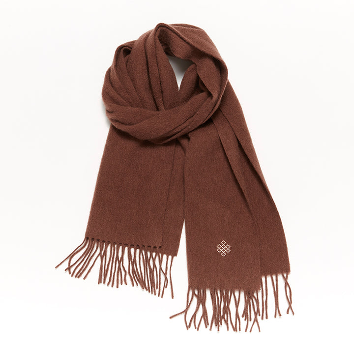 Experience ultimate comfort and warmth with the Serene Sugar Graham Scarf. Crafted from 100% yak wool, it's the perfect luxurious accessory for colder months.

