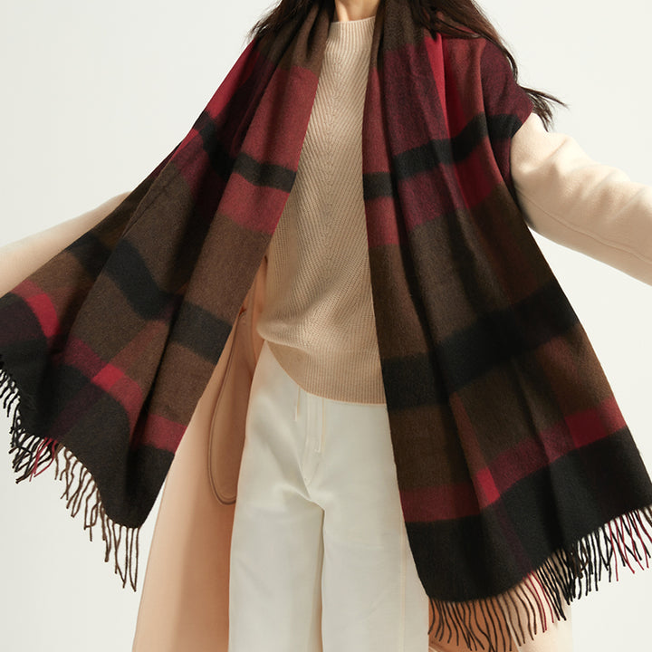 Wrap yourself in luxury with the Serene Plaid Shawl. Made from 100% yak wool, this soft, warm accessory in classic hues adds elegance to any winter outfit.

