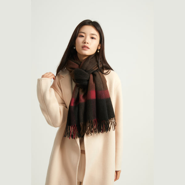 Wrap yourself in luxury with the Serene Plaid Shawl. Made from 100% yak wool, this soft, warm accessory in classic hues adds elegance to any winter outfit.


