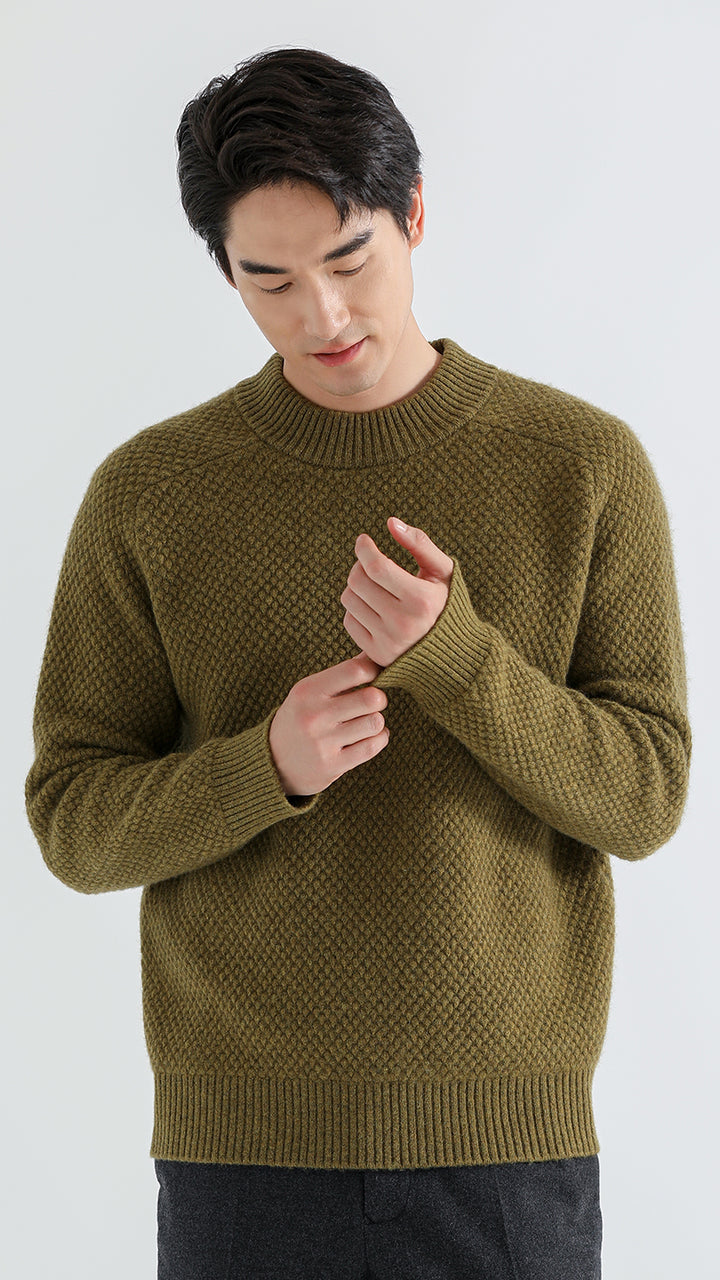 Discover luxury and warmth with the Shambala Half High Collar Spruce Seed Yak Wool Pullover. Made from 100% yak wool, this sweater offers a soft, cozy fit, perfect for cold weather styling.

