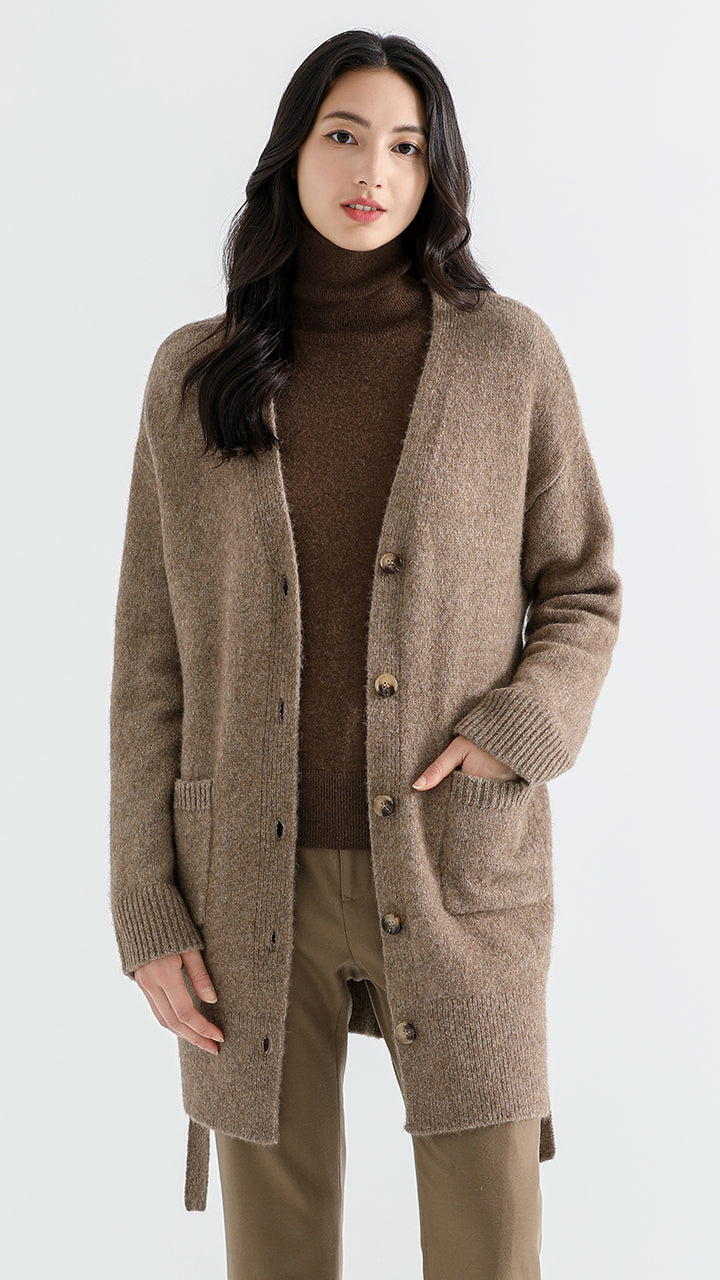 Embrace cozy elegance with the Above Land Classic Long Cardigan. Crafted from a unique yak, alpaca, wool, and nylon blend, this cardigan features a relaxed fit, extended sleeves, and stylish side slits. Inspired by Tibetan grasslands, it offers both warmth and sophistication.