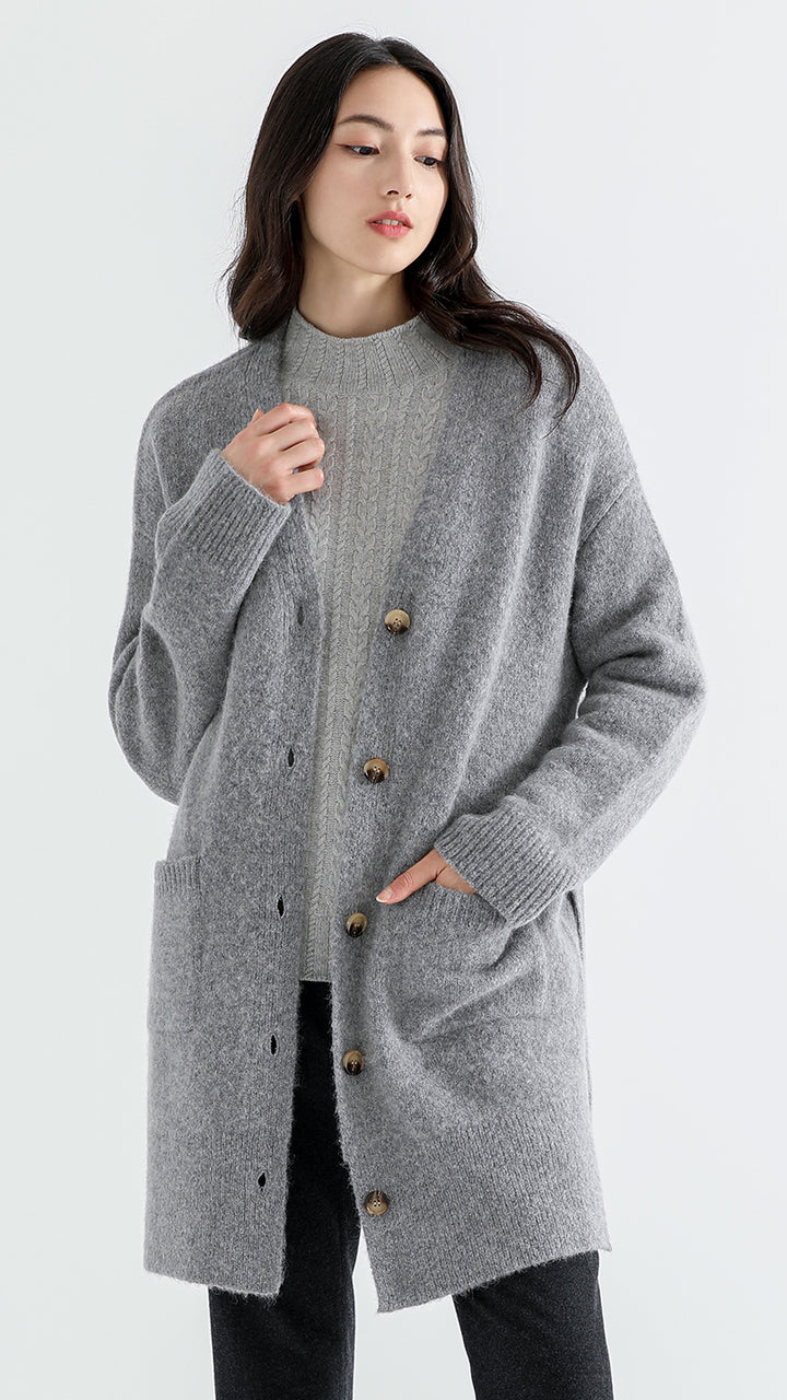 Embrace cozy elegance with the Above Land Classic Long Cardigan. Crafted from a unique yak, alpaca, wool, and nylon blend, this cardigan features a relaxed fit, extended sleeves, and stylish side slits. Inspired by Tibetan grasslands, it offers both warmth and sophistication.
