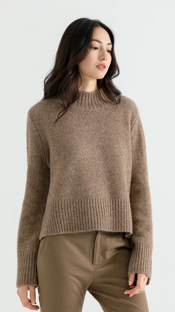 Elevate your wardrobe with the Above Land Cropped Sweater. Made from a luxurious yak wool blend, this stylish and cozy piece offers a relaxed fit, perfect for layering. A versatile design that combines comfort with modern flair.