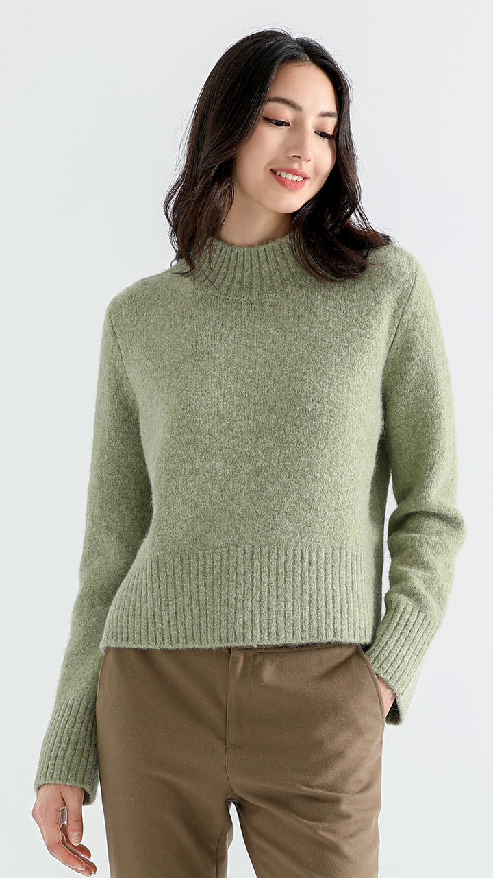 Elevate your wardrobe with the Above Land Cropped Sweater. Made from a luxurious yak wool blend, this stylish and cozy piece offers a relaxed fit, perfect for layering. A versatile design that combines comfort with modern flair.