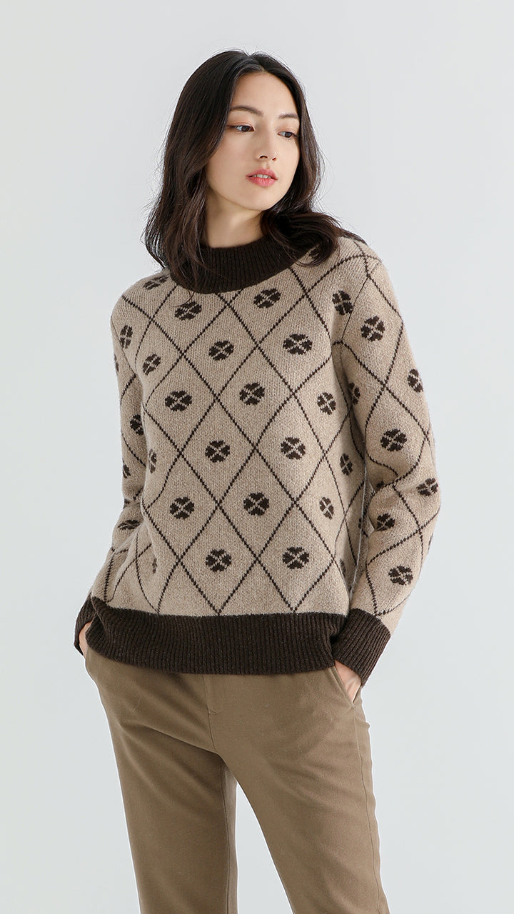 Stay stylish and warm with the Women's Shambala Half Turtleneck Jacquard Yak Wool Pullover. Crafted from 100% Yak wool, this luxurious and textured pullover offers comfort and sophistication for every occasion.

