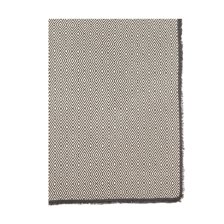 Add warmth and sophistication to your space with the Shoton Diamond-pattern Throw in Stormy Day/Alpine. Made from 100% yak wool, this luxurious blanket is perfect for cozying up on chilly days.