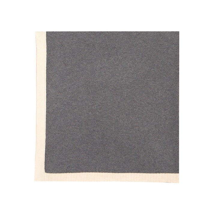 Elevate your home with the Shoton Multi-use Pillow/Throw. Crafted from luxurious yak wool, this versatile piece in Stormy Day and Alpine hues with white trim is perfect for cozying up or adding a touch of elegance to any room.