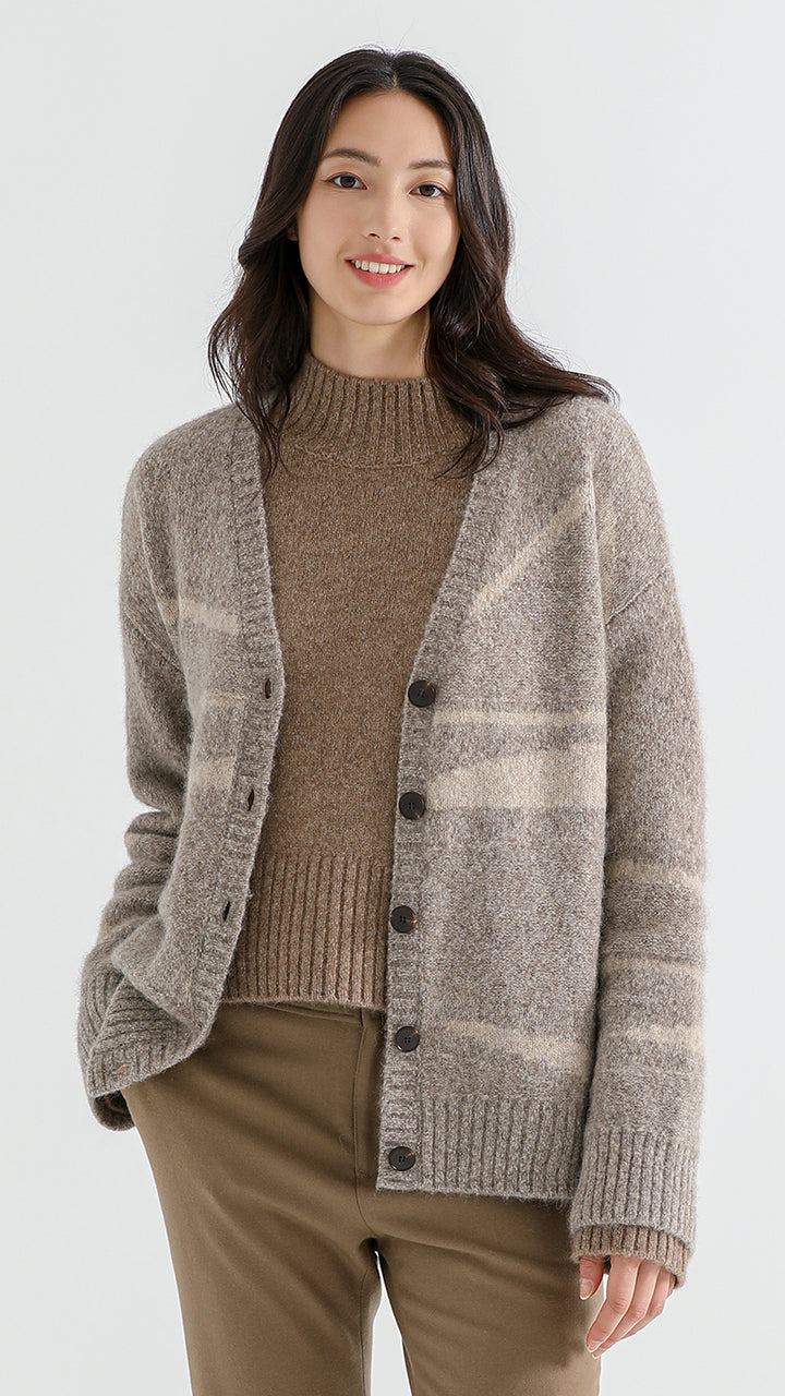 Add sophistication to your wardrobe with the Above Land Jacquard Cardigan. Crafted from a luxurious yak wool blend, this elegant outerwear piece features intricate jacquard patterns, perfect for layering over any outfit. Cozy, stylish, and versatile for every season.



