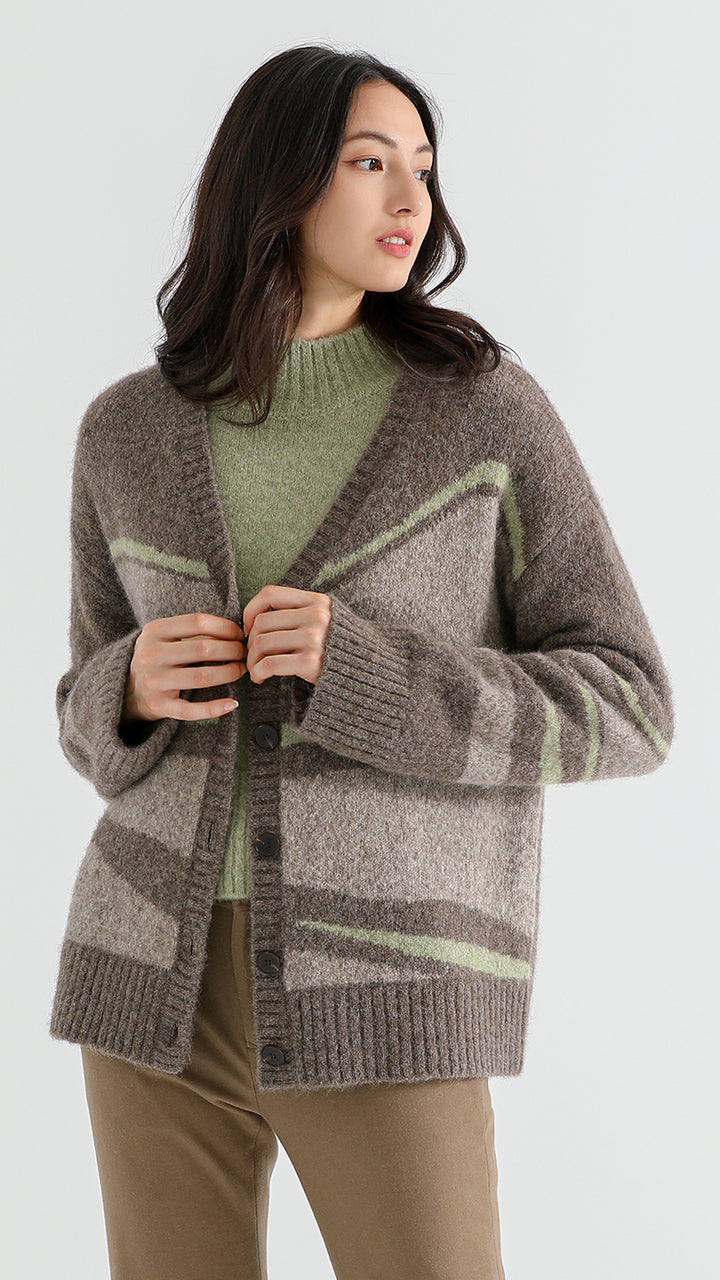 Add sophistication to your wardrobe with the Above Land Jacquard Cardigan. Crafted from a luxurious yak wool blend, this elegant outerwear piece features intricate jacquard patterns, perfect for layering over any outfit. Cozy, stylish, and versatile for every season.



